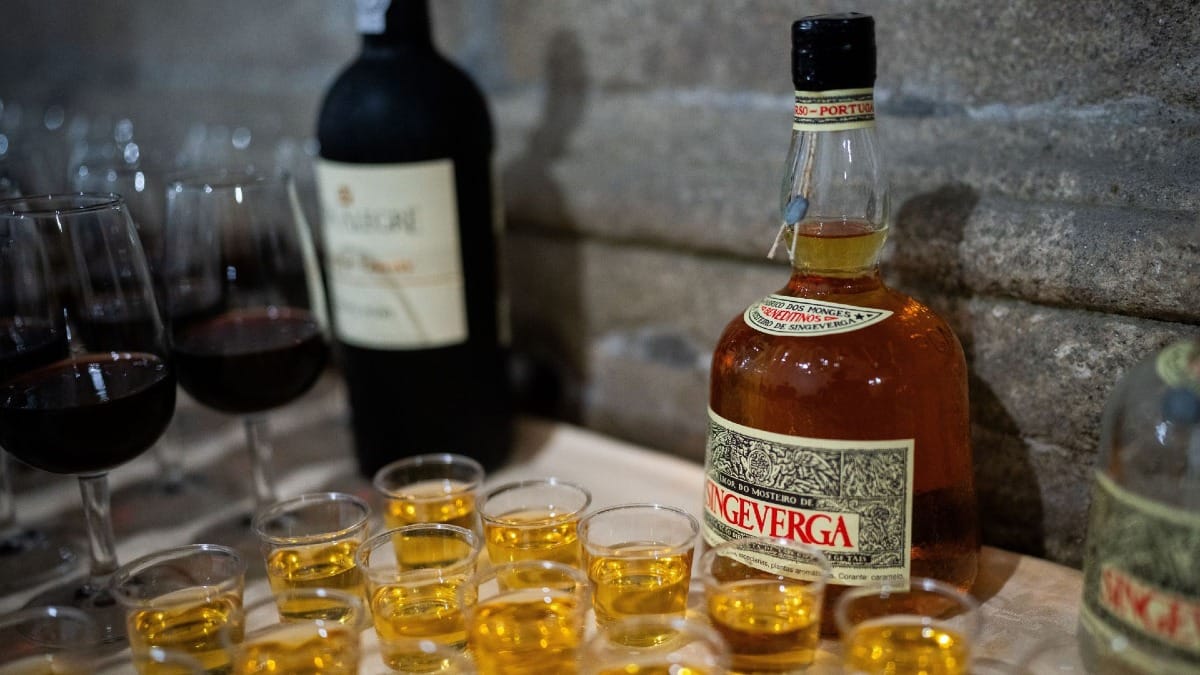 Singeverga liqueur bottle and glasses, a traditional Monastery-produced liqueur in Porto, Portugal