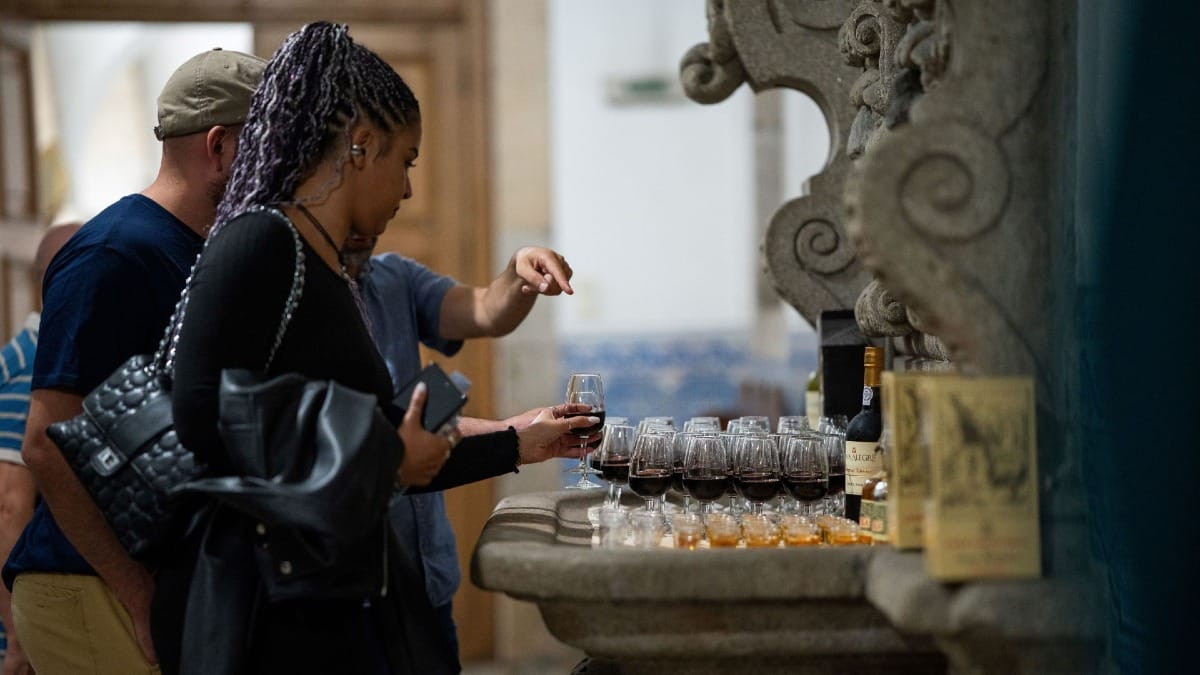 Interior of a historic Monastery in Porto, Portugal, with Port wine and liqueur glasses enriching the Fado live show experience