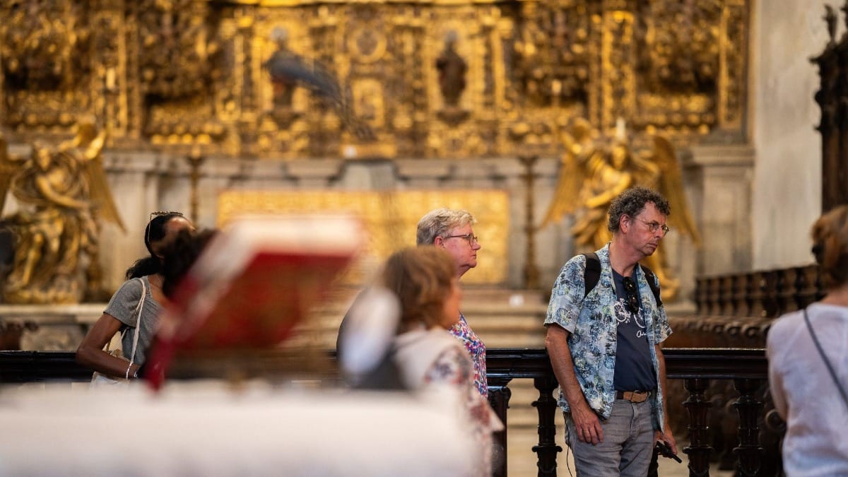 Guests appreciating the intricate details and heritage of the Monastery during a guided tour in Porto, Portugal