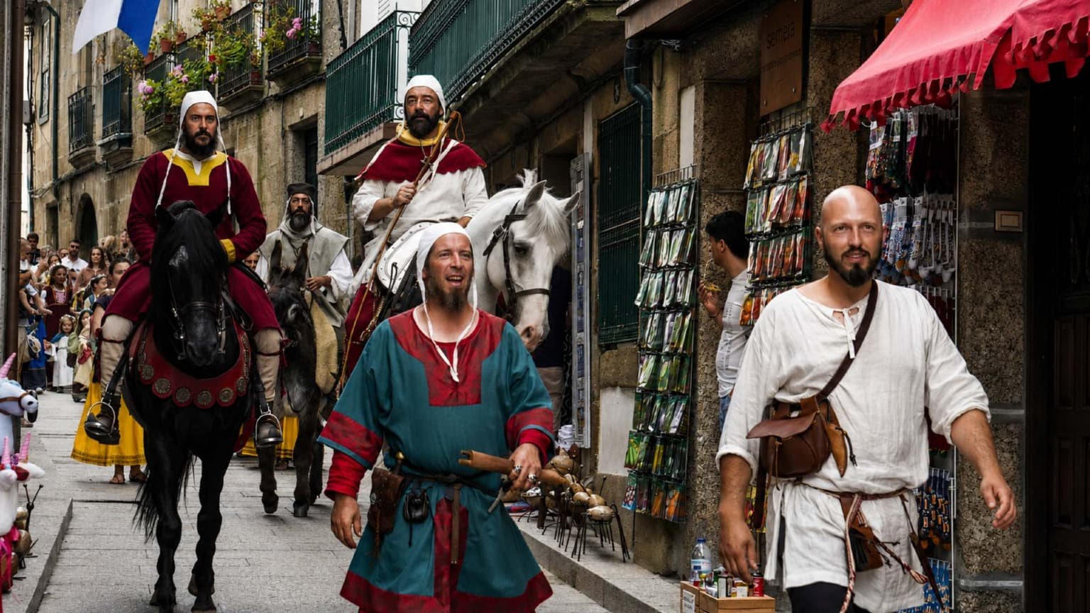 Historical reenactment with horses and medieval participants during Festa Afonsina festival in Guimarães Portugal