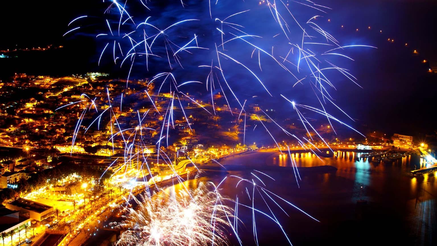 Night fireworks over Machico Bay in Madeira, part of the island’s iconic multi-day New Year’s Eve celebrations