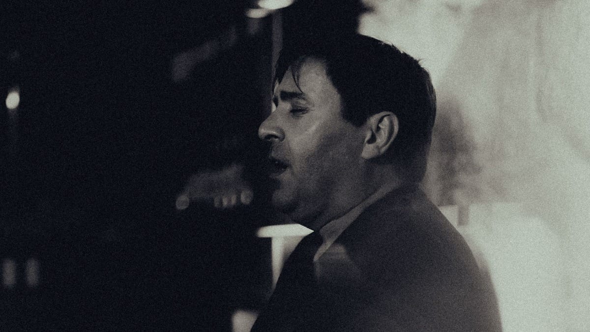 Male singer passionately delivering the soul of Fado, the traditional Portuguese music genre