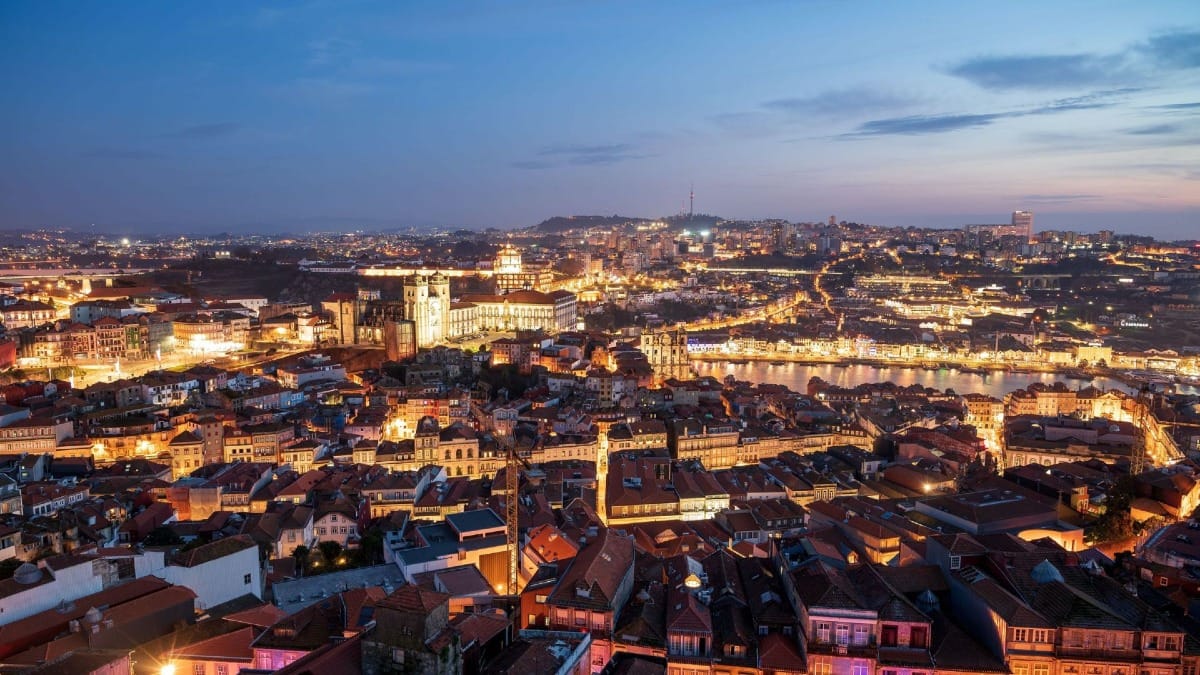Discover the charm of Porto's World Heritage Site as day turns into night during the Night Guided Tour with Cooltour Oporto