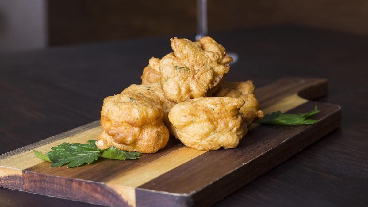 Golden codfish fritters, a traditional Portuguese appetizer served during the Porto wine tour