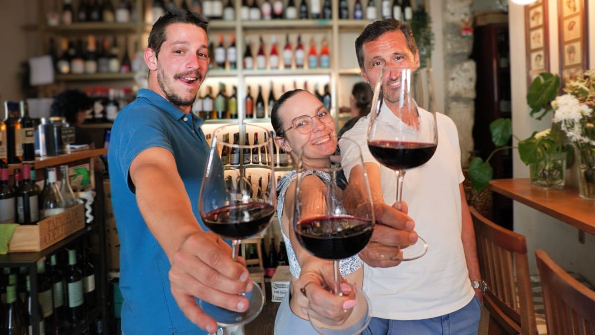 Cheers with red wine during a guided wine tasting tour before a live Fado performance in Porto by Cooltour Oporto